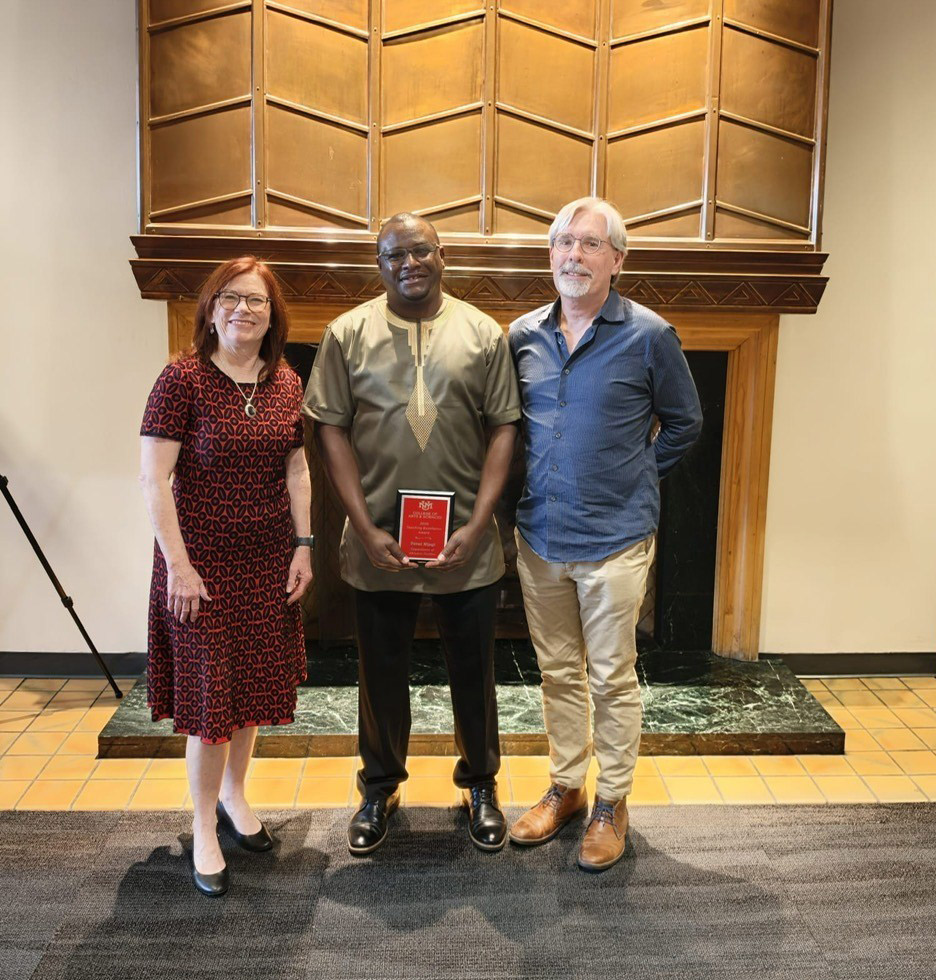 Dr. Peter Njagi receiving this year's College of Arts and Sciences Teaching Excellence Award